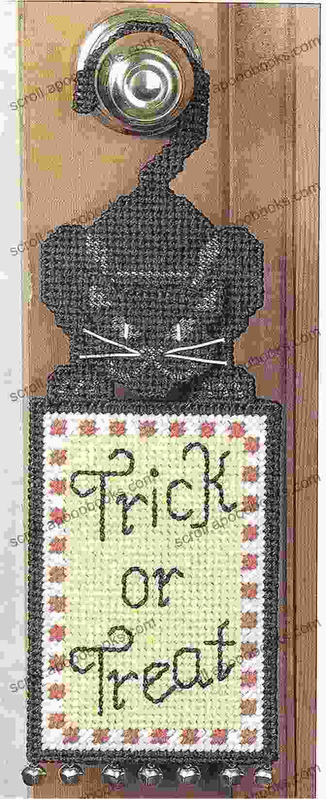 An Adorable Plastic Canvas Door Hanger Featuring A Playful Cat Design. Door Hangers Galore: 18 Patterns In Plastic Canvas