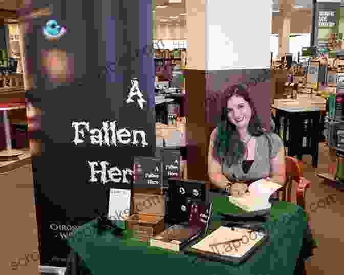 An Author Signing Books At A Book Signing Event. Authors Need Your Help