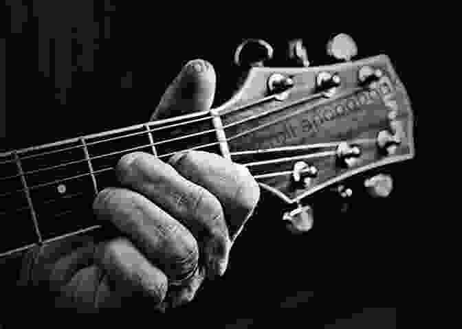 Close Up Of Blues Musician Playing Guitar, Showcasing The Intricate Details Of The Instrument Living The Blues Bob Wiseman